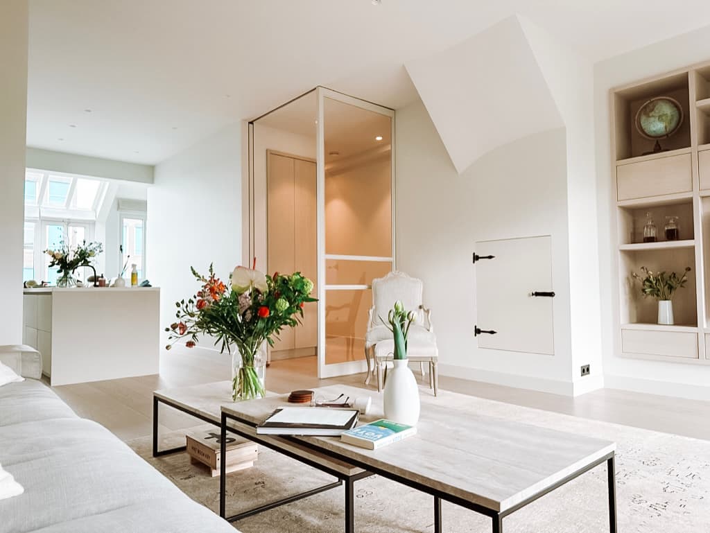 Amsterdam living room with trees outside the windows